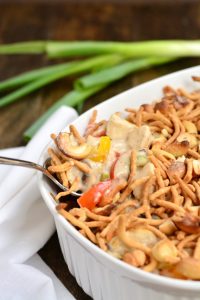 Creamy Cashew Chicken Casserole filled with rice, chicken, bell peppers, and topped with crunchy chow mein noodles and cashews