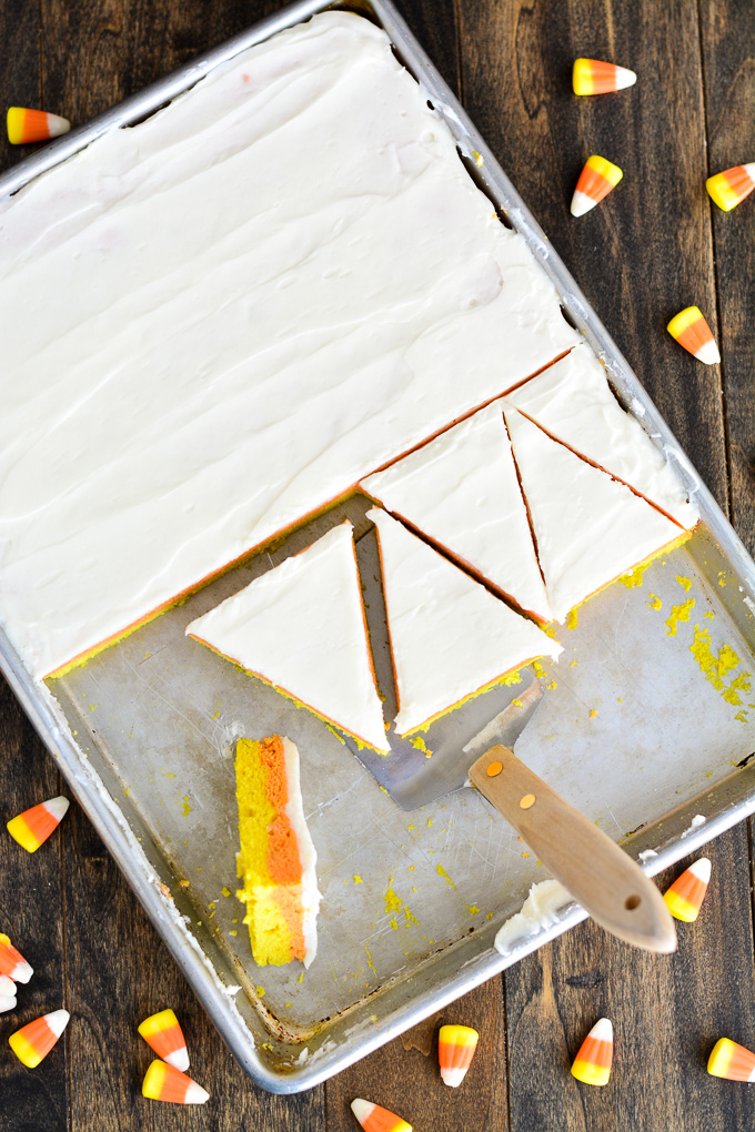 Candy Corn Sugar Cookie Bars in a pan cut out into triangles.