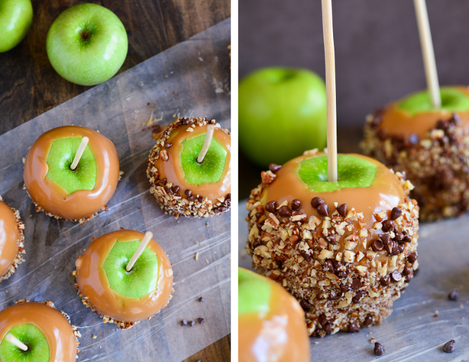 Close up of a caramel apple coated in nuts and chocolate chips.