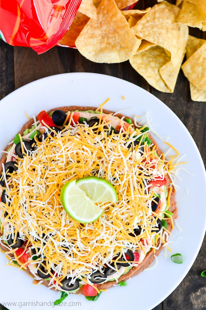 Mexican Layered Dip is the perfect crowd pleasing appetizer for any party.