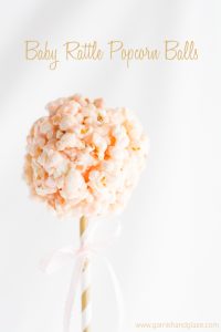 Popcorn balls made to look like baby rattles. Perfect for a baby shower!