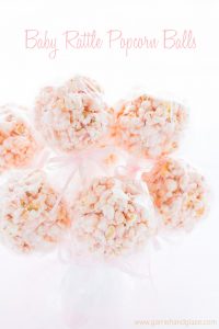 Popcorn balls made to look like baby rattles. Perfect for a baby shower!
