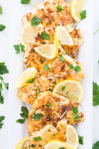 Chicken Francais is moist and tender thinly pounded chicken that is pan-seared and served with a buttery lemon sauce on top.