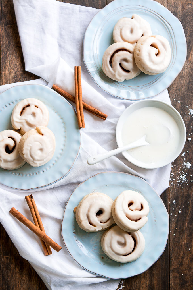 Enjoy your favorite breakfast for dessert with these Cinnamon Roll Cookies made with a soft sugar cookie, cinnamon and sugar rolled up inside, and glazed.