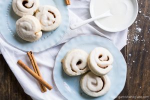Cinnamon and sugar rolled up in sugar cookie dough and then iced to create Cinnamon Roll Cookies.