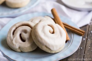 Cinnamon and sugar rolled up in sugar cookie dough and then iced to create Cinnamon Roll Cookies.