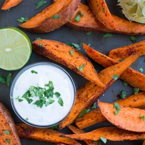 Skip the greasy fries and enjoy these scrumptious baked Sweet Potato Wedges with Honey Lime Dip.