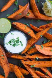 Skip the greasy fries and enjoy these scrumptious baked Sweet Potato Wedges with Honey Lime Dip.