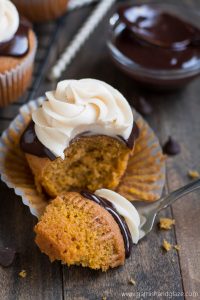 A perfectly moist pumpkin cupcake covered in rich chocolate ganache and topped with cinnamon cream cheese frosting.