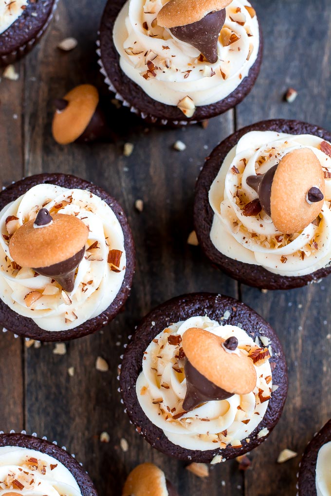 Celebrate Autumn with these cute Chocolate Almond Acorn Cupcakes topped with almond buttercream and an acorn made of a Vanilla Wafer and almond Kiss.