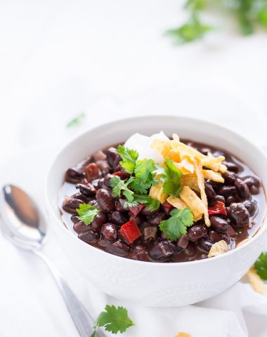 Cozy up this fall with a warm bowl of this flavorful, high protein, high fiber, vegan Black Bean Soup.