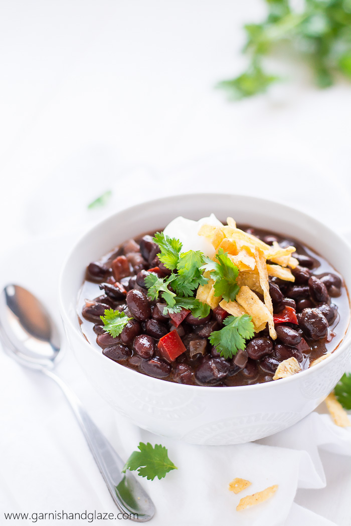 Cozy up this fall with a warm bowl of this flavorful, high protein, high fiber, vegan Black Bean Soup.
