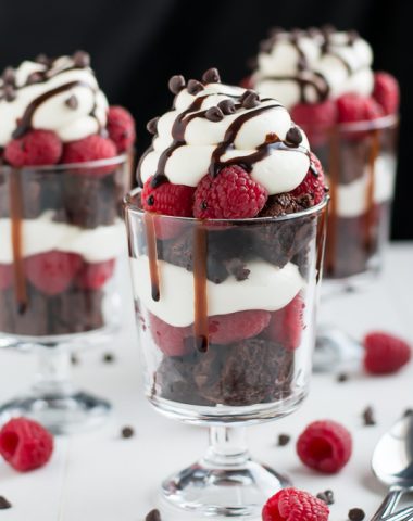 Nothing says "love" like these Raspberry Cheesecake Trifles made with rich chocolate from-scratch chocolate chip brownies, easy no-bake cheesecake filling, and fresh sweet raspberries.