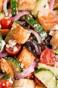 Make Greek Panzanella to use up your leftover French bread in this veggie filled summer salad.
