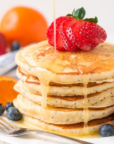 Your weekends just got a whole lot better with these Orange Poppy Seed Pancakes. Top with fresh berries and Orange Syrup and you'll be in heaven.