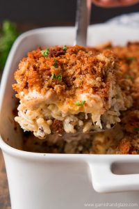 Chicken & Wild Rice Casserole is the ultimate comfort food layered with flavorful rice, chicken, a cheesy sauce, and crispy stuffing.