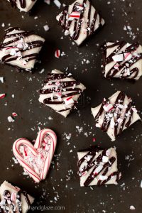 Enjoy the holidays with these rich dark chocolate Cream Cheese Peppermint Brownies topped with a delicious cream cheese frosting, ganache, and crushed candy cane.