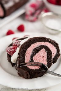 With raspberry cream filling, chocolate ganache, whipped cream, and fresh berries, this Raspberry Chocolate Swiss Roll is sure to make your Valentine swoon.