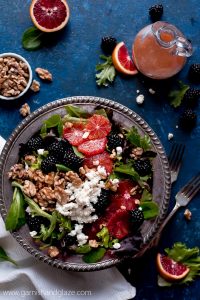 Grab a bowl of this BLACKBERRY BLOOD ORANGE SALAD with blood orange vinaigrette, creamy goat cheese, and toasted walnuts. Eating healthy never tasted so good!