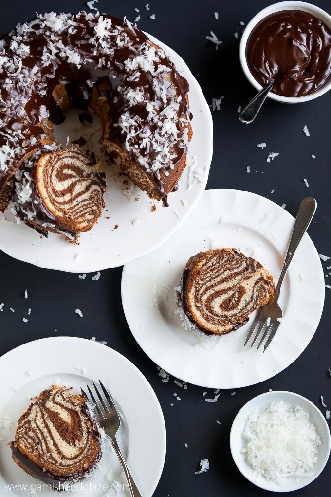 Your dinner guests will be in awe of this gorgeous, yet easy to make, Surprise-Inside CHOCOLATE COCONUT ZEBRA CAKE topped with ganache and sweet coconut flakes.