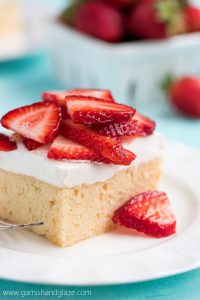 For a sweet, cool, and refreshing summer party dessert, whip up this Strawberry Topped Tres Leches Cake. Cake never tasted so good!