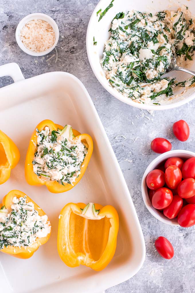 Enjoy these easy-to-make Vegetarian Spinach Ricotta Stuffed Peppers with Blistered Tomatoes for a beautiful and healthy vegetarian meal.