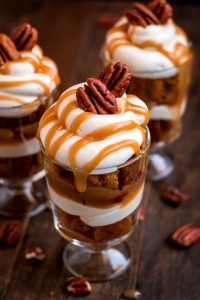 Dig in to one of these heavenly Mini Caramel Pecan Pumpkin Cheesecake Trifles layered with rich brown sugar caramel, toasted pecans, cheesecake filling, and moist pumpkin cake.
