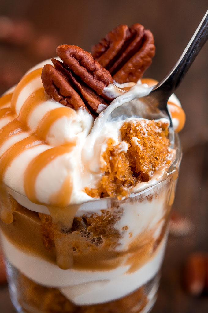 Dig in to one of these heavenly Mini Caramel Pecan Pumpkin Cheesecake Trifles layered with rich brown sugar caramel, toasted pecans, cheesecake filling, and moist pumpkin cake.