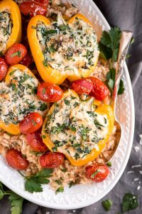 Enjoy these easy-to-make Spinach Ricotta Stuffed Peppers with Blistered Tomatoes for a beautiful and healthy vegetarian meal.