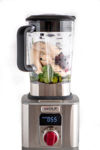 Berry Spinach Smoothie ingredients in Wold Gourmet Blender with digital timer display.