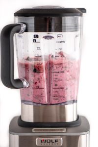 Berry Spinach Smoothie ingredients blending in Wold Gourmet Blender.