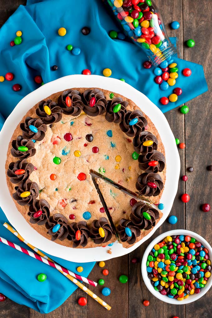 Full Chewy M&M Cookie Cake and bowl of m&m's 