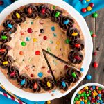 Whether you're celebrating a birthday or just want something sweet, this candy loaded Chewy M&M COOKIE CAKE is a dessert you must try.