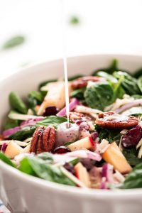Autumn Poppy Seed Spinach Salad is the perfect side to any dinner. It's loaded with amazing toppings, good-for-you greens, and topped with the most delicious homemade poppy seed dressing.