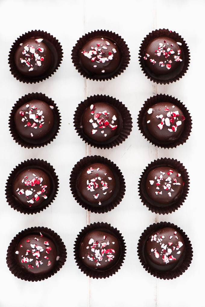 Top view of chocolate truffles garnished with crushed peppermint.