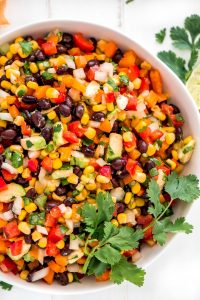 Black Bean and Corn Salsa is an easy 10 minute dip that is down right delicious and healthy. Serve it at your next party or for an afternoon snack.