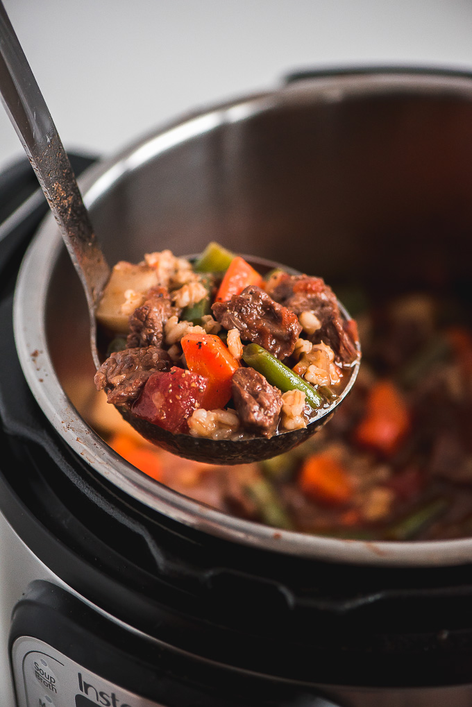 Ladle full of Instant Pot Beef and Barley Soup