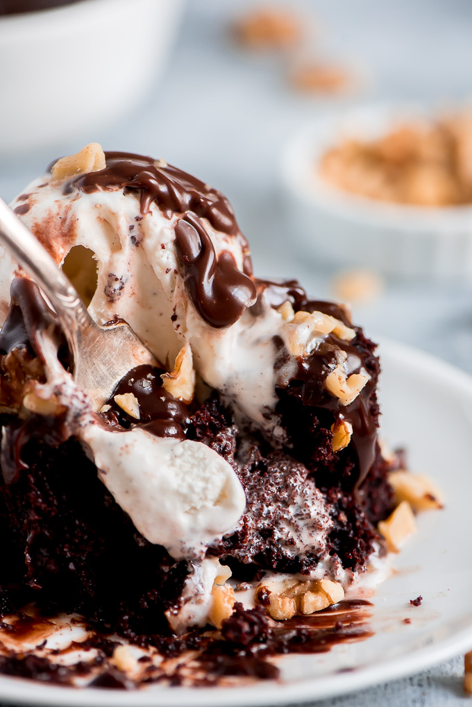 Getting a fork full of Chocolate Mayonnaise Cake loaded with ice cream, fudge, and nuts.