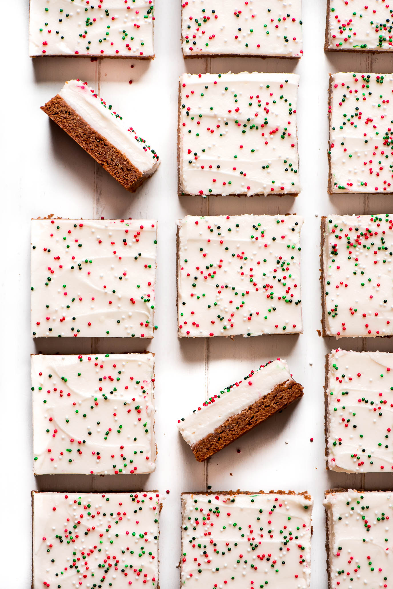 Top view of Christmas Sugar Cookie Bars topped with cream cheese frosting and sprinkles.