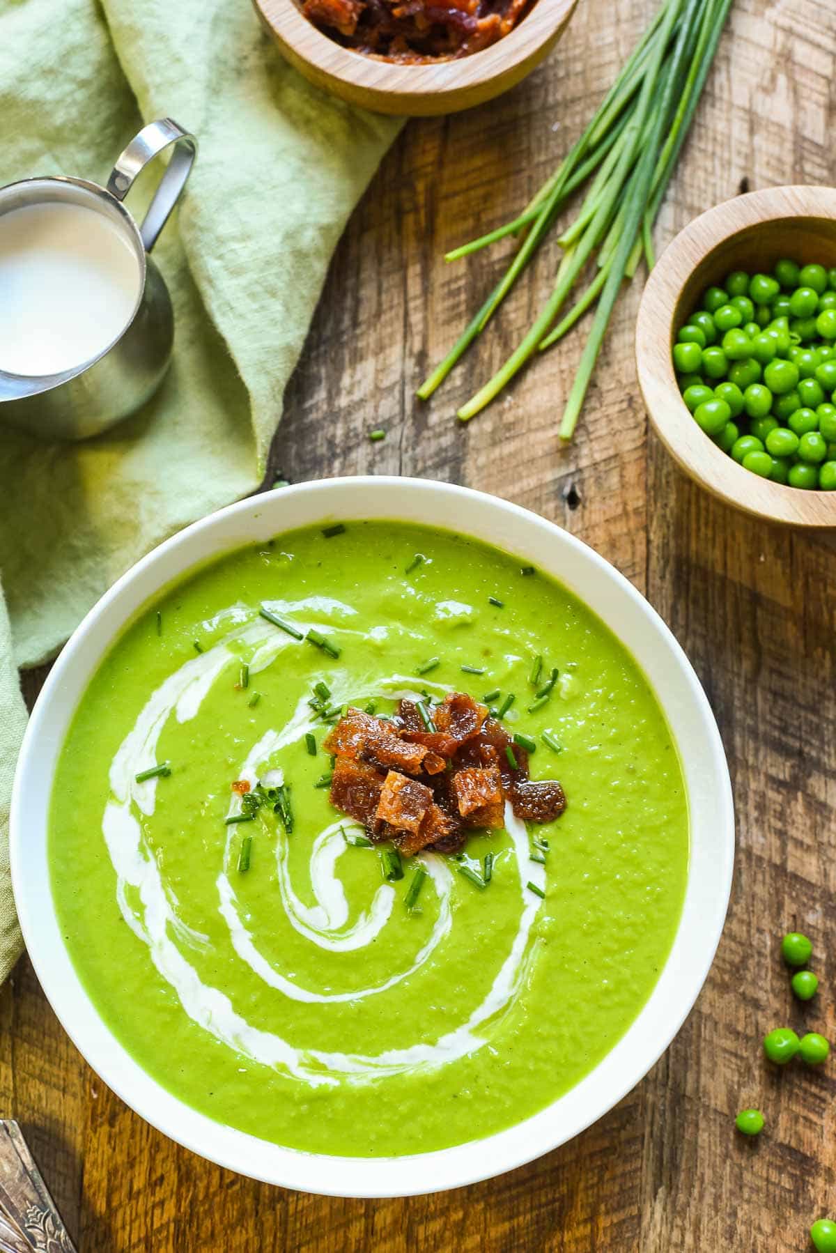 Green Pea Soup with Candied Bacon and a swirl of of sour cream
