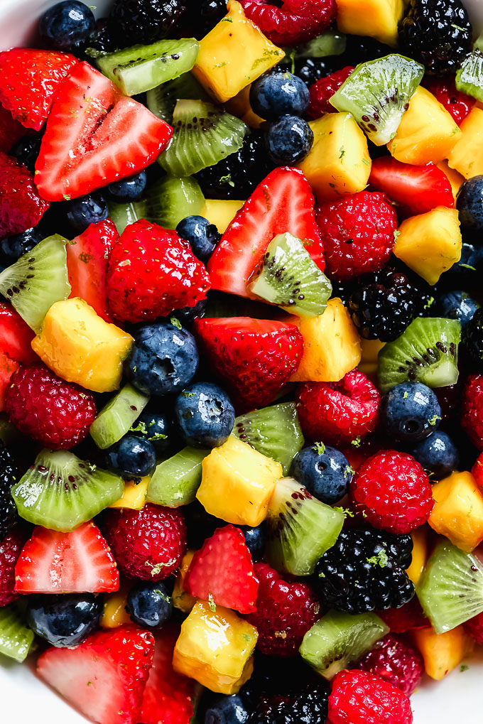 Close-up shot of mixed berries, kiwi, and mango.