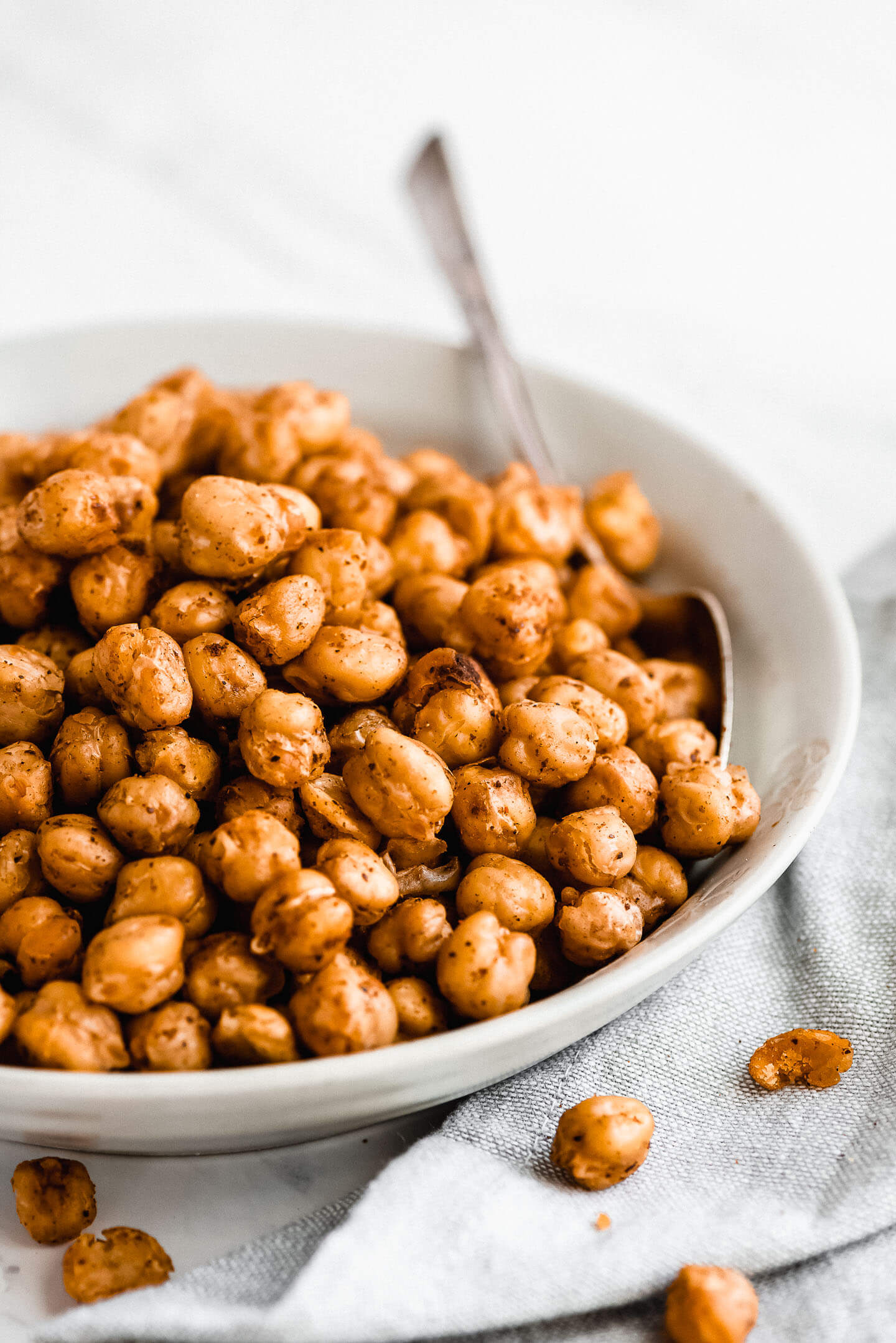 A close up shot of seasoned Roasted Chickpeas in a bowl.