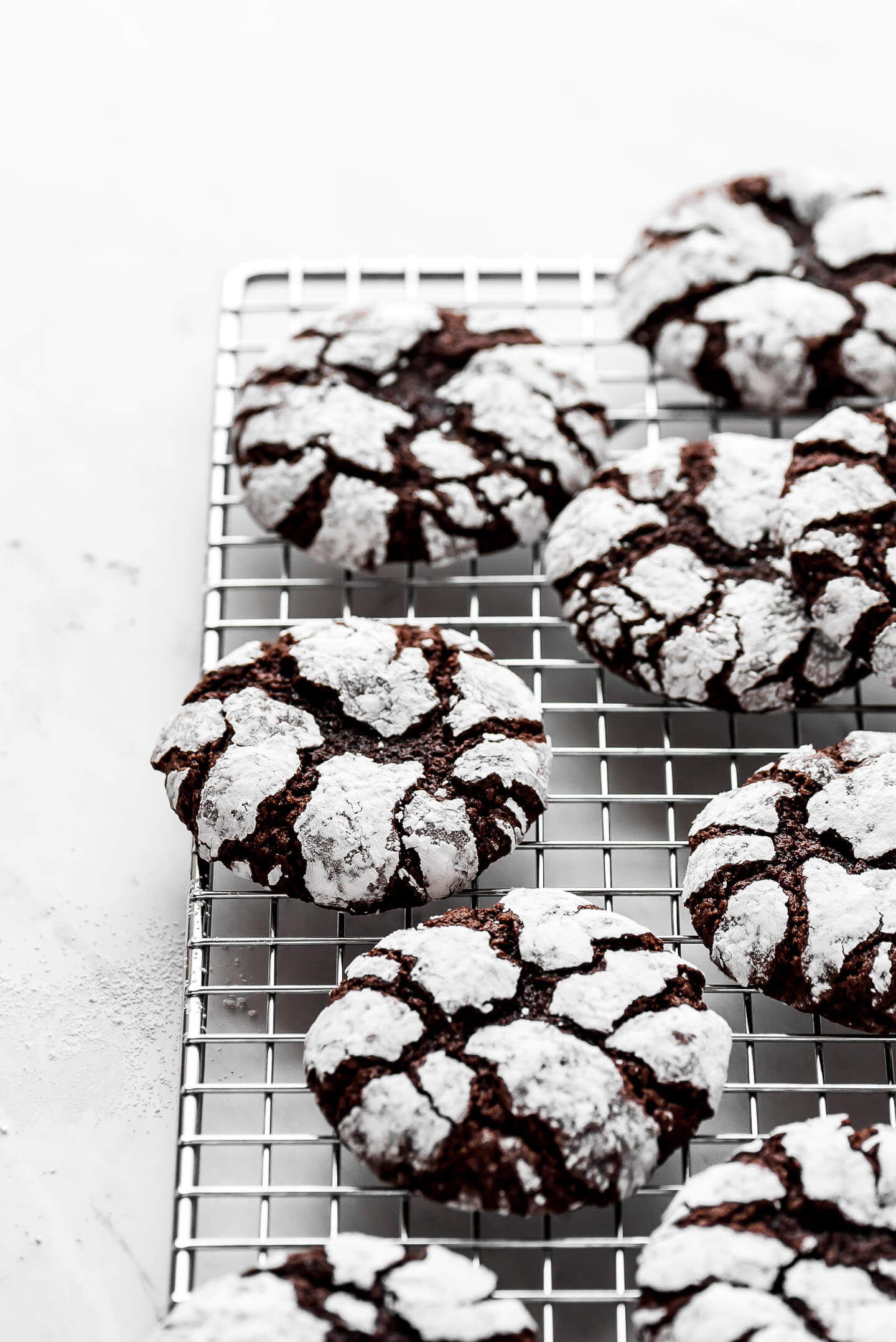 Chocolate cookies covered in powdered sugar.