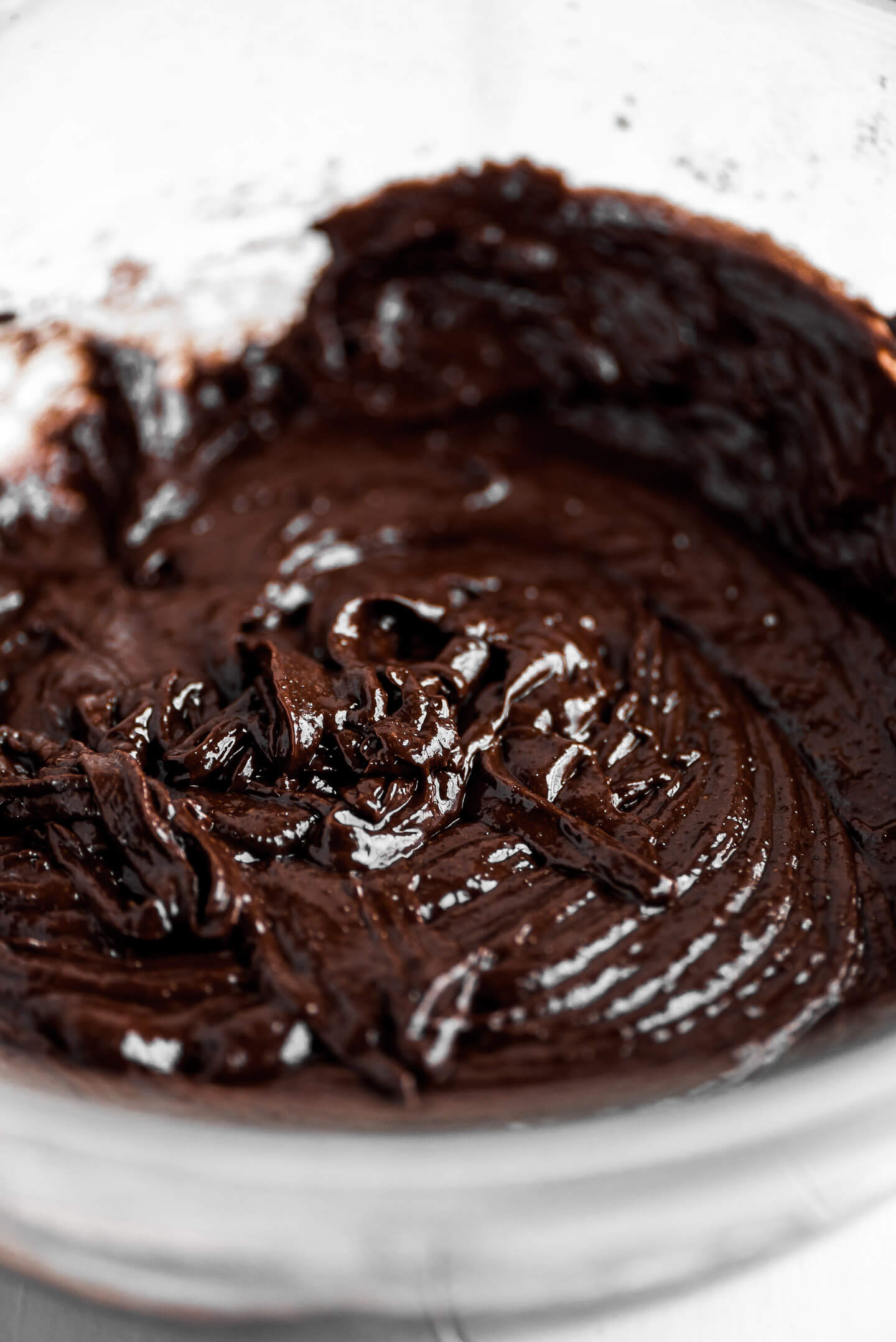 Thick chocolate brownie batter in a bowl.