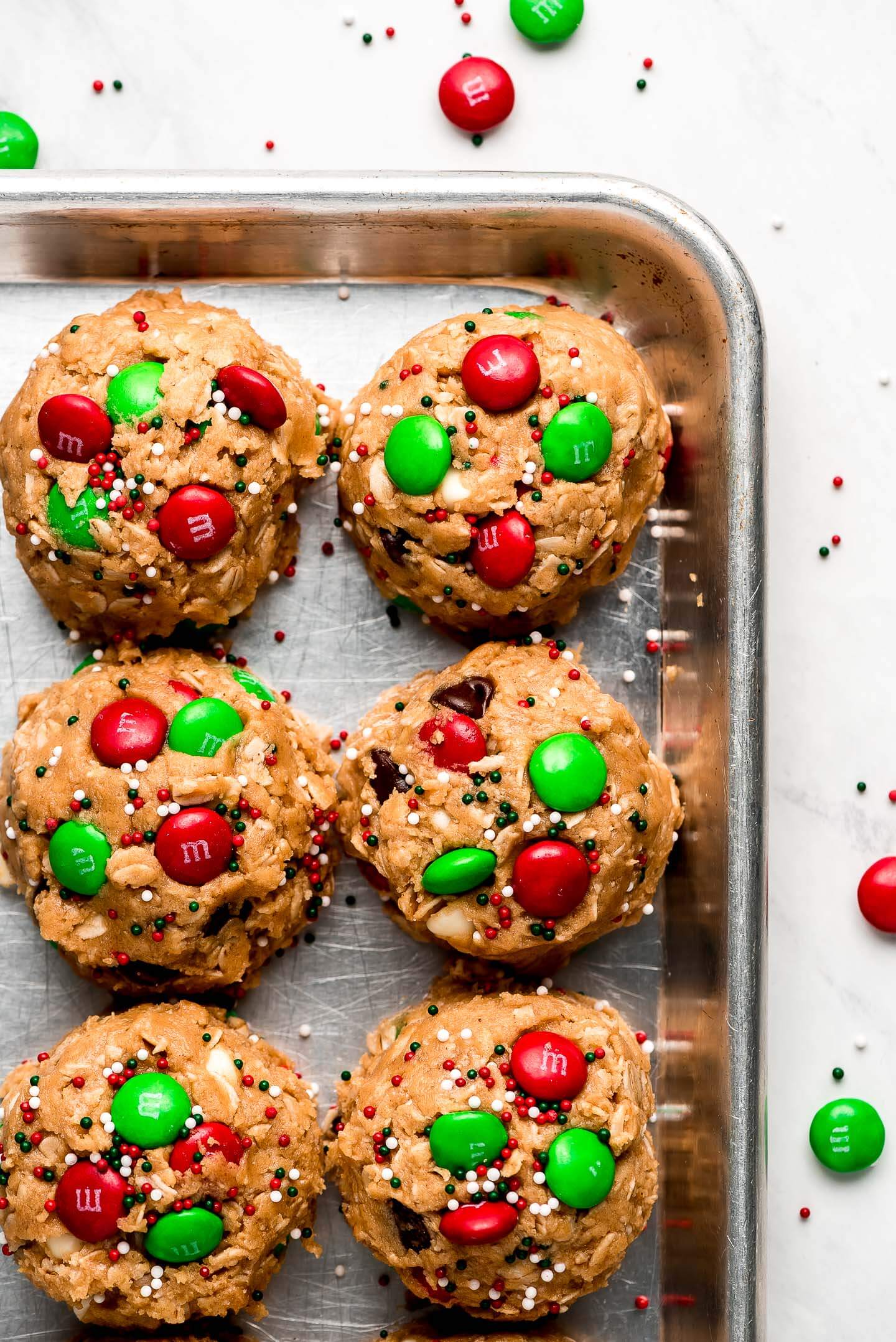 Santa's Cookies cookie dough balls on a baking sheet.