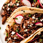 Three Barbacoa Tacos on a plate.