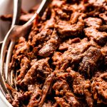 A large serving bowl of shredded Beef Barbacoa.