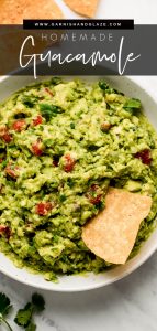 Top view of a large bowl of Homemade Guacamole with a chip in the side.