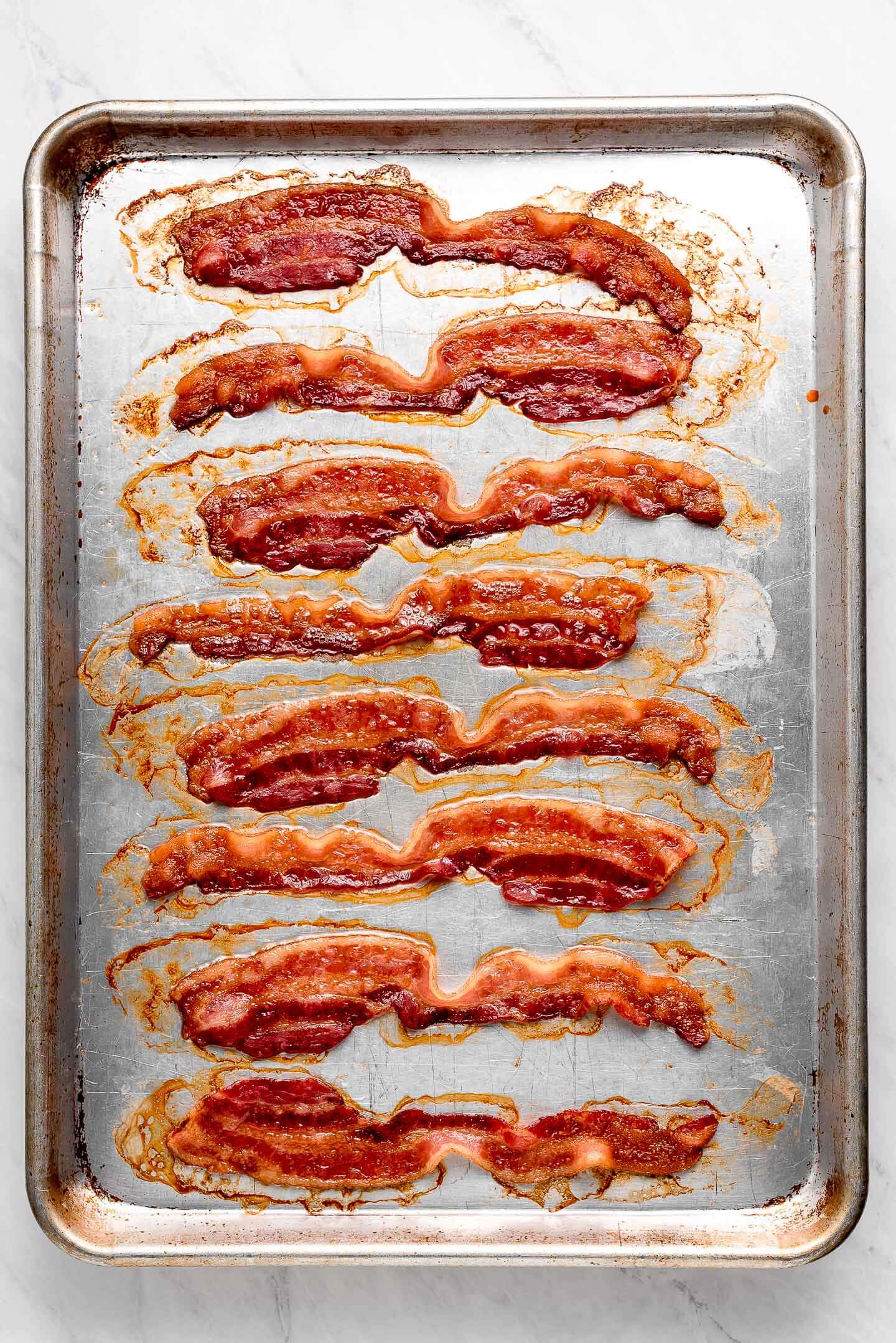Cooked Bacon on a sheet pan.
