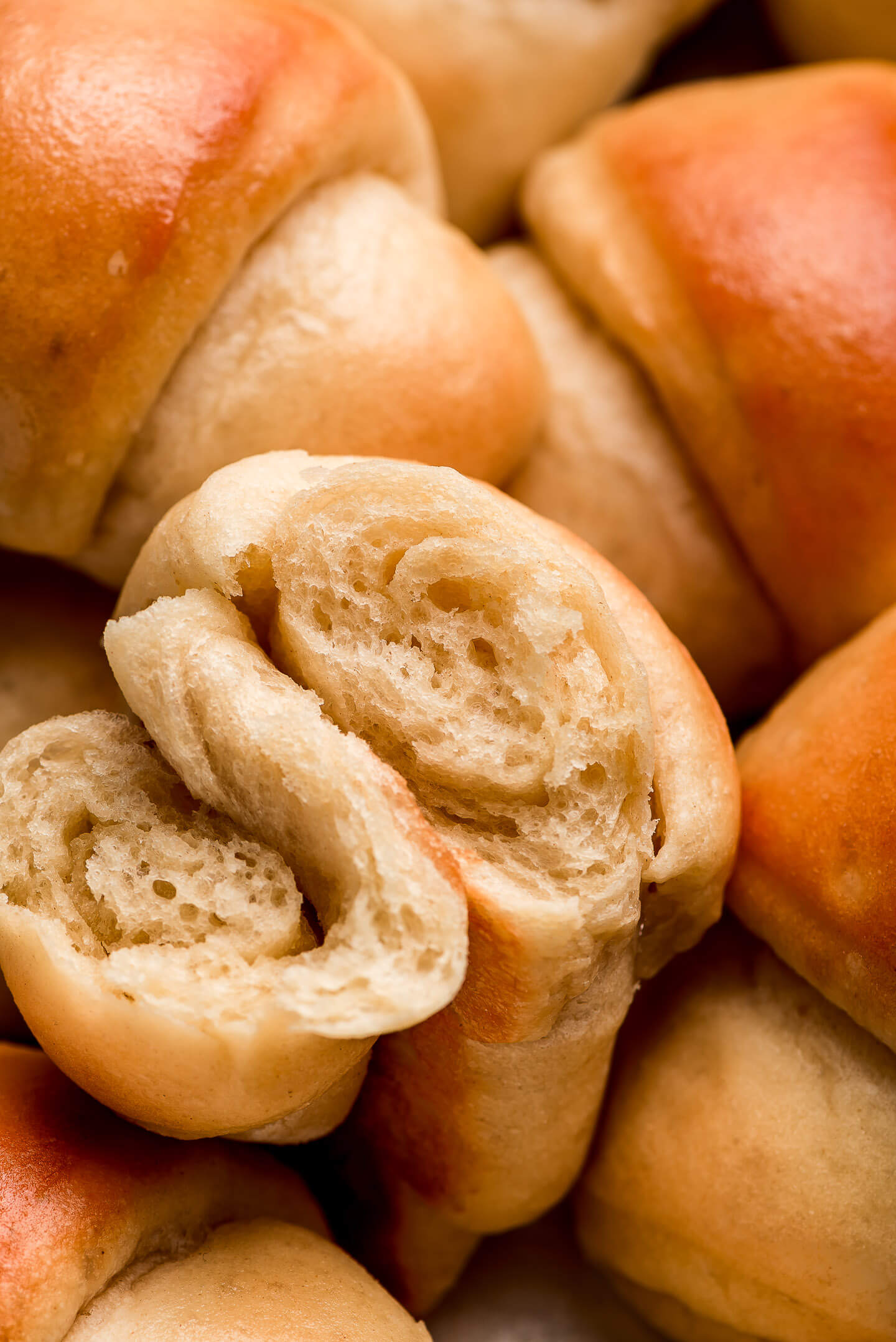 Close up shot of the inside of a light and fluffy crescent roll.